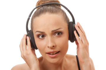 Fototapeta premium woman listening music with headphones, on white