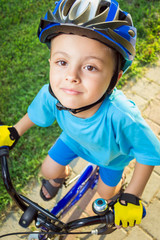 Fototapeta na wymiar Little boy riding a bike