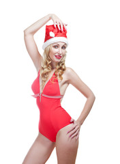  beautiful woman in red bathing suit and a red cap  Santa Claus