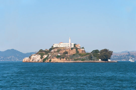 Alcatraz jail island in San Francisco bay with a beautiful blue