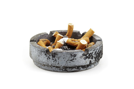old ashtray full of cigarettes
