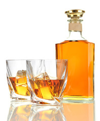 Glasses of whiskey with bottle, isolated on white