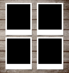 blank photo frame on brown wood plank background