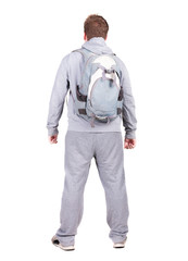 Naklejka premium Back view of man with backpack looking up.