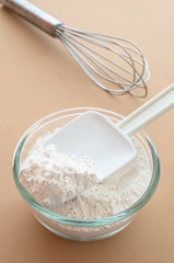 Still life of wheat flour and untensil.