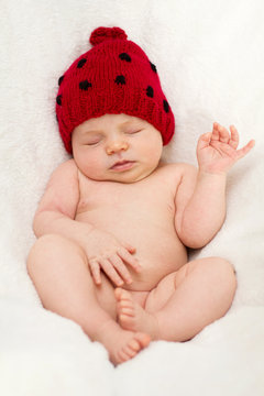 Baby Girl With A Red Hat