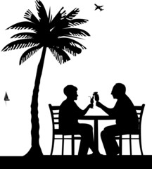 Elderly couple drinking cocktails on the beach under palm tree