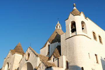 Fototapeta premium San Antonio trullo church in Alberobello, Italy