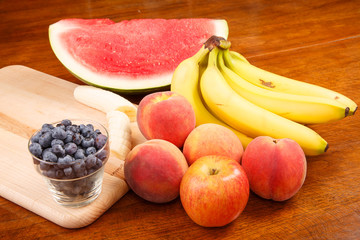 Whole and Cut Fruit on Table