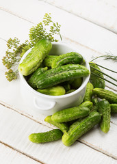 Fresh cucumbers on wooden background