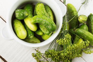 Fresh cucumbers on wooden background