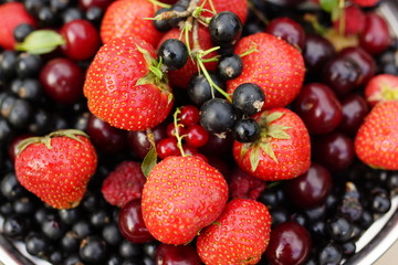 Fototapeta na wymiar sweet summer berries: strawberries, cherry, currant, raspberry