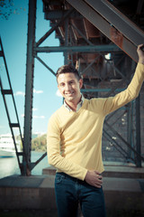 Portrait of a young man smiling outside