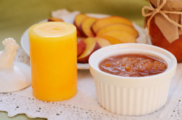 Homemade peach jam in white bowl