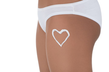 Body care. Close-up of beautiful women's body with a heart shap