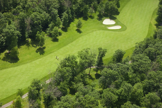 Aerial view of a golf course fairway with golfers