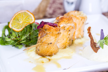 baked salmon rolls on a table in a restaurant