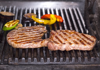 cooking a steak on the grill in the restaurant
