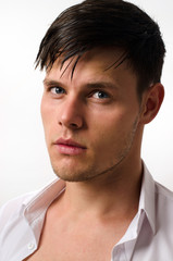 Portrait of a beautiful man posing fashion in a studio