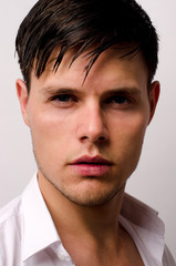 Obraz premium Portrait of a beautiful man posing fashion in a studio