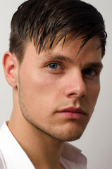 Obraz premium Portrait of a beautiful man posing fashion in a studio