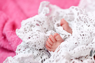 Tiny feet of a newborn baby