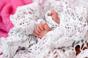 Tiny feet of a newborn baby