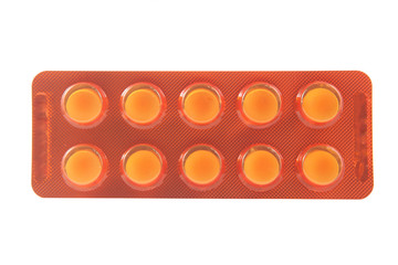 Medicine tablet in yellow transparent blister pack