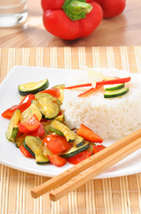 Plate of vegetable fried rice and chopstick