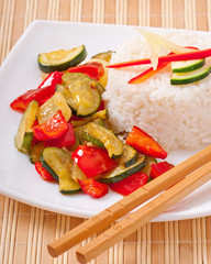 Plate of vegetable fried rice and chopstick