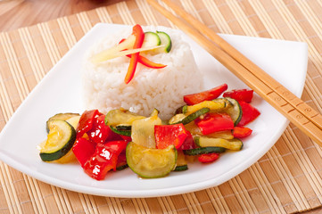 Plate of vegetable fried rice and chopstick