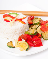Plate of vegetable fried rice and chopstick