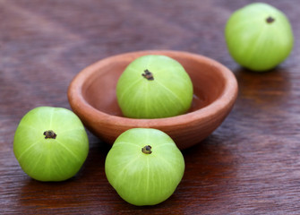 Fresh amla with a small bowl