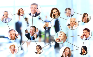 A group of people talking on the phone