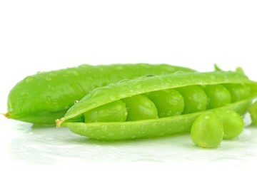 Fresh wet peas in a pod on a white background