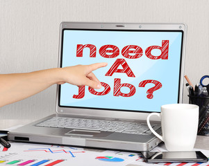 hand pointing to laptop