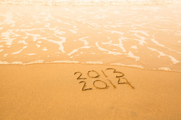 2013 - 2014 - written in sand on beach texture