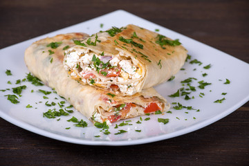Pita bread wrapped with cottage cheese and vegetables