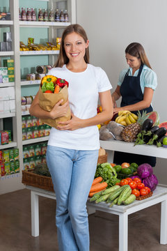Woman Holding Grocery Bag At Grocery Store