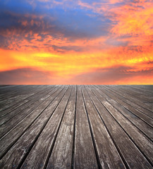 Fototapeta na wymiar blue sunset sky and wood floor, background