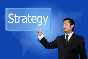 businessman hand pushing strategy button on a touch screen inter