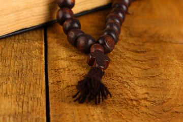 the Wooden rosary beads and holy bible