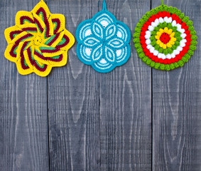Knit flower potholders.