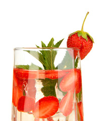 Glass of fruit drink with ice cubes isolated on white