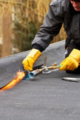 Man repairing a roof