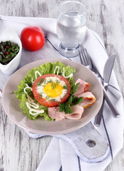 Bacon on plate on board on napkin on board on window table