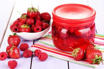 Home made berry jam on wooden table