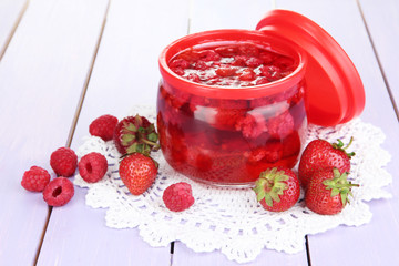 Home made berry jam on wooden table