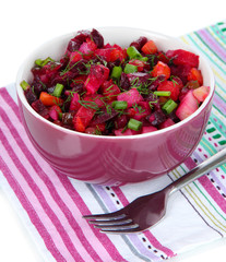 Beet salad in bowl isolated on white