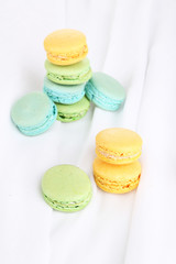 Macaroons on white cloth close-up